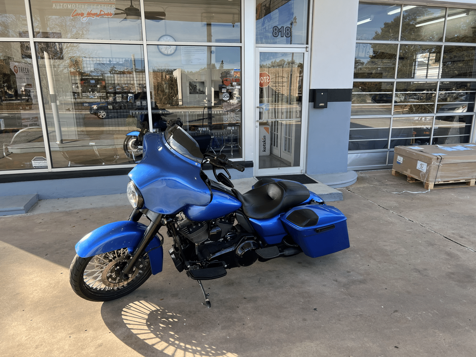 Blue motorcycle customized by Premier Customs