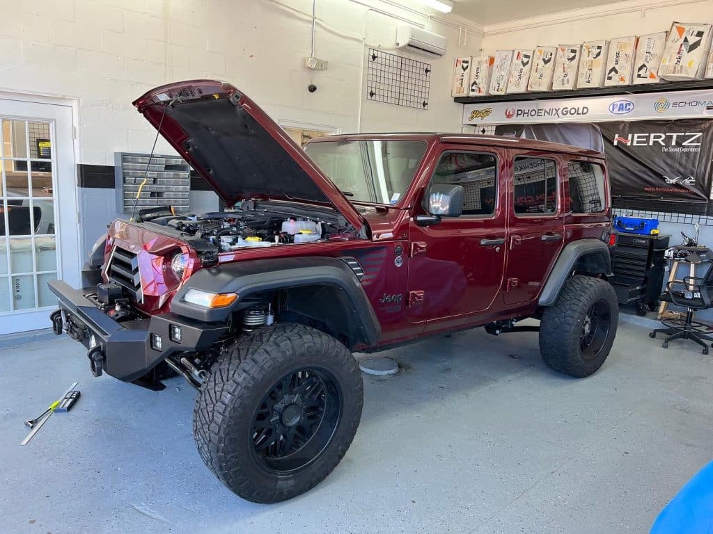 Customized Jeep Wrangler with hood open