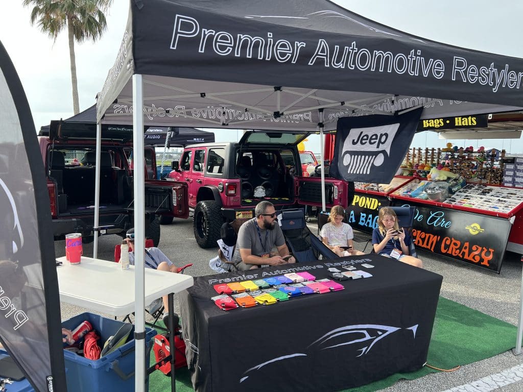 Premier Automotive tent at a car show