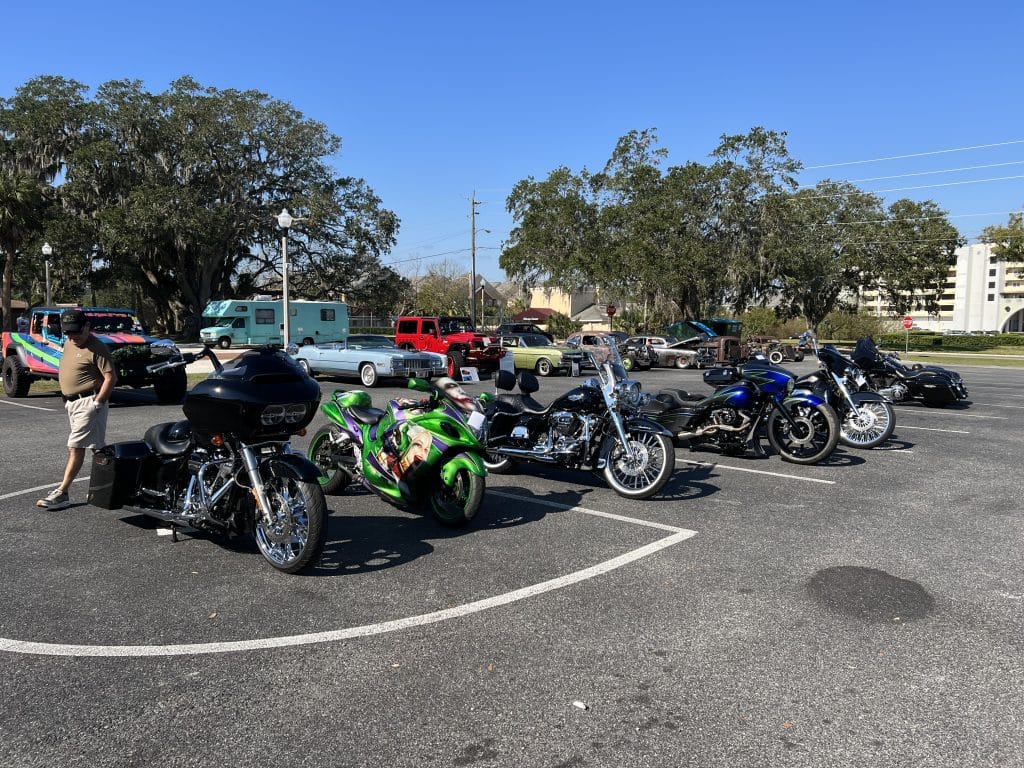 row of motorcycles in a parking lot