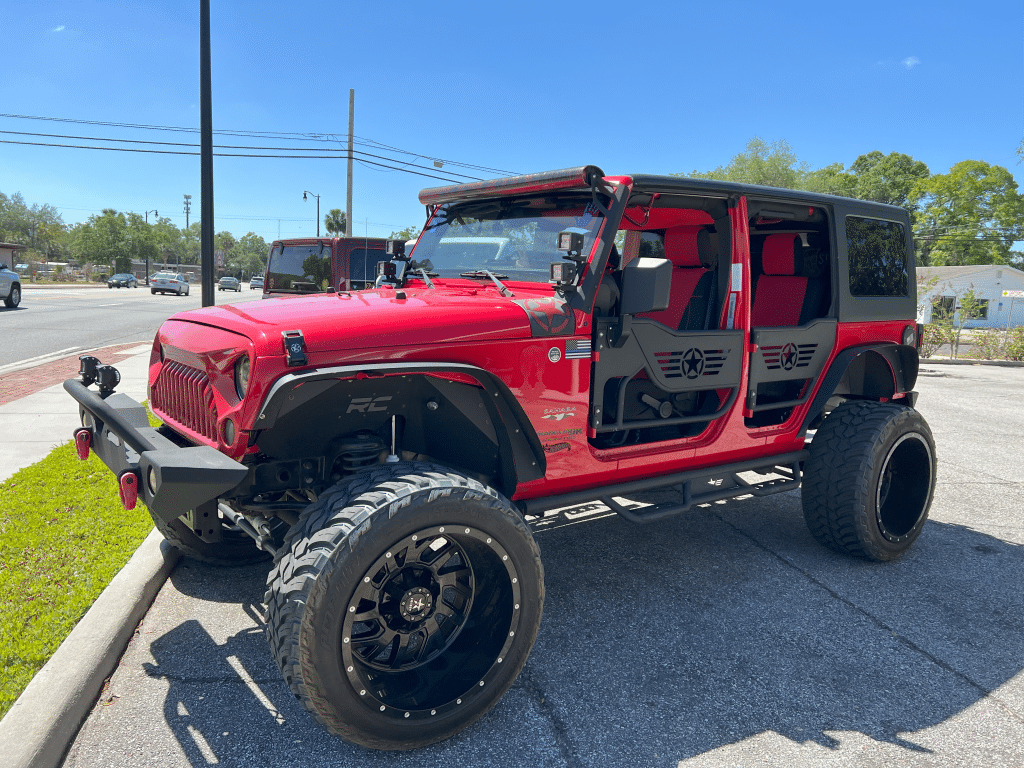 Jeep with custom doors and lift by Premier Customs